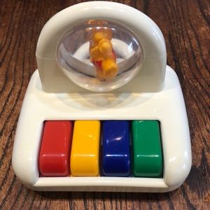 Vintage toy piano. Plays it's a small world.